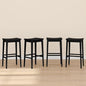 Plank+Beam Smythe Bar Stool, 30", Set of 4, Sturdy Wood Modern Kitchen Bar Height Stool, Saddle Seat Backless Bar Chair, Metal Footrest, Black