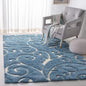 SAFAVIEH Florida Shag Collection Area Rug - 6' x 9', Light Blue & Cream, Scroll Design, Non-Shedding & Easy Care, 1.2-inch Thick Ideal for High Traffic Areas in Living Room, Bedroom (SG455-6011)