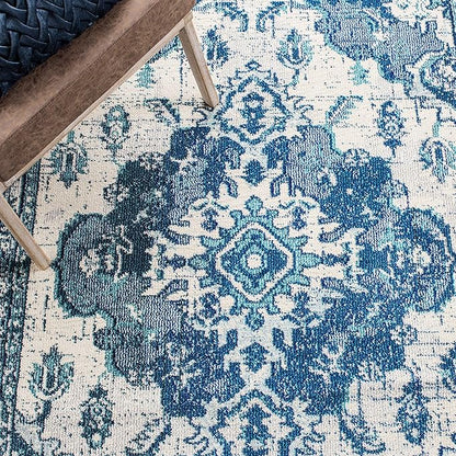 SAFAVIEH Monaco Collection Area Rug - 5'1" x 7'7", Ivory & Blue, Boho Chic Medallion Distressed Design, Non-Shedding & Easy Care, Ideal for High Traffic Areas in Living Room, Bedroom (MNC243A)
